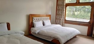 Pine-Park-Hotels-shogran-bed-room