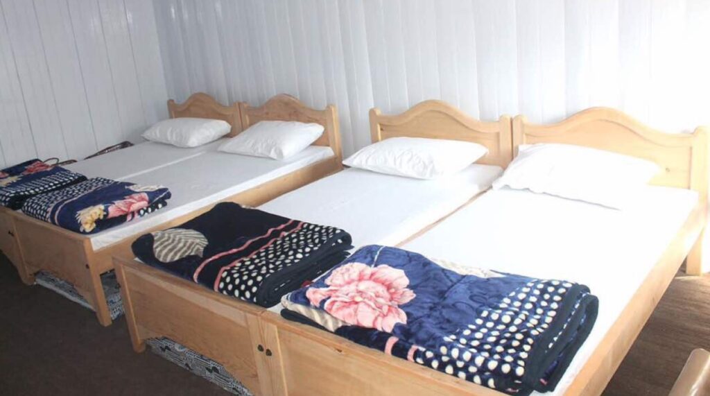 Shangrila Sharda Resort master bed room